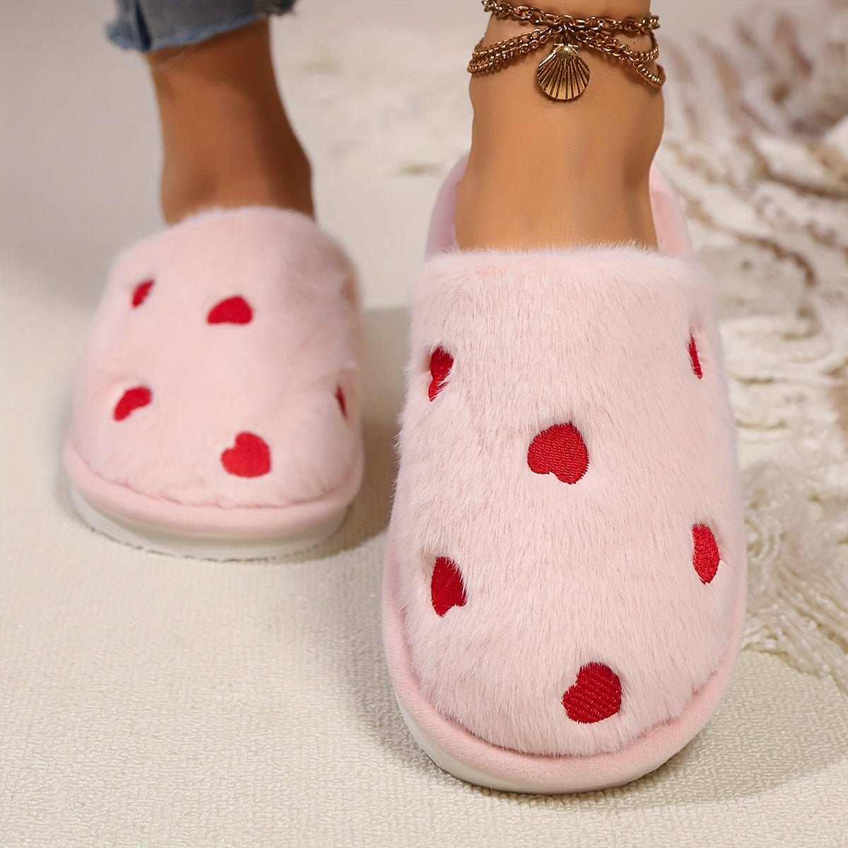 Soft and warm women's winter slippers with heart pattern - cozy and cute design, non-slip sole, hand washable, available in black, white, pink.