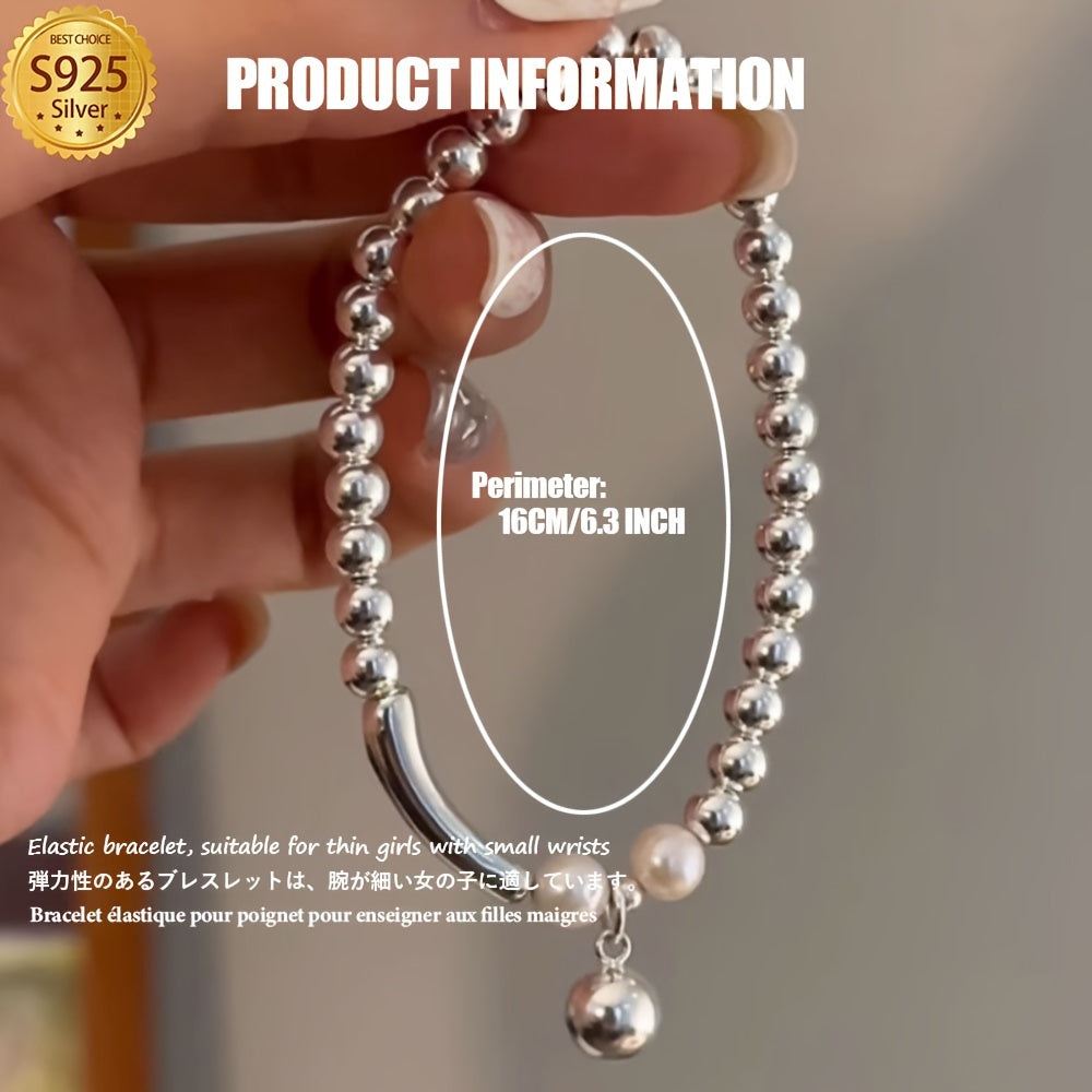 This Elegant Silvery Bracelet features embedded pearls, exuding luxury and sophistication. With a high-end and unique design, it is cool, refreshing, and perfect for those seeking individuality. This exquisite piece is a great gift, guaranteed to bring