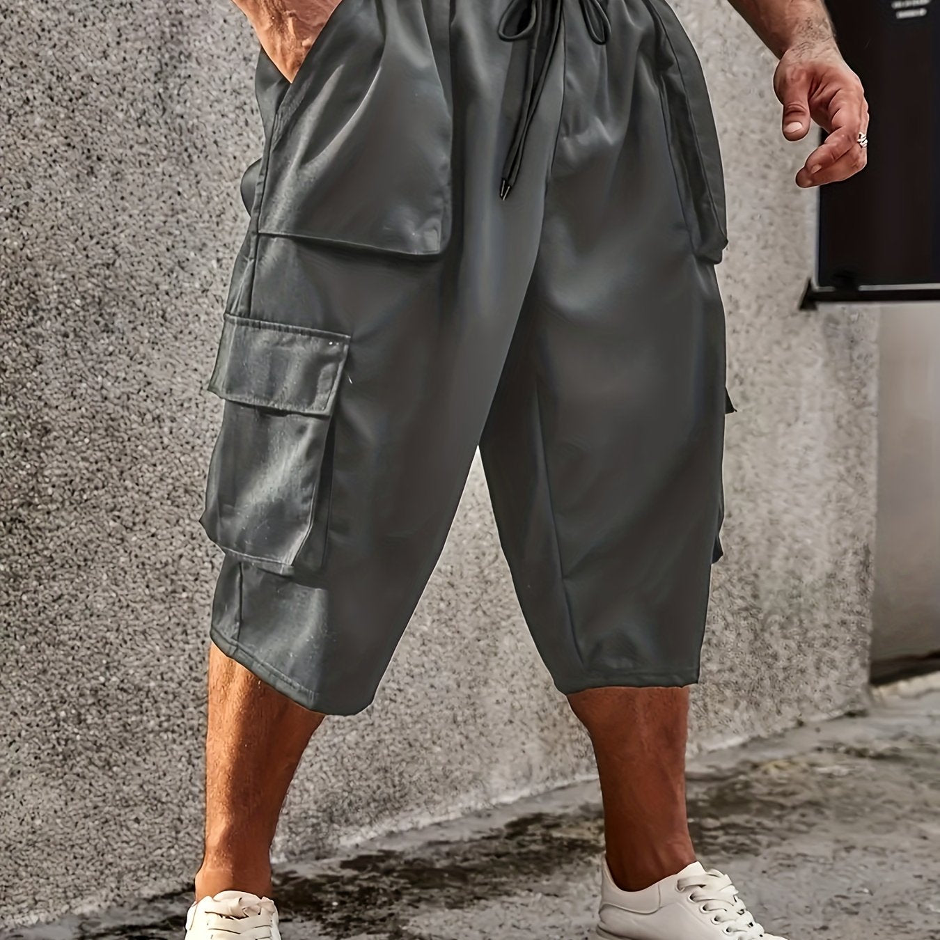 Men's plus size cargo pants with drawstring and pockets, loose fit, and comfortable breathability.