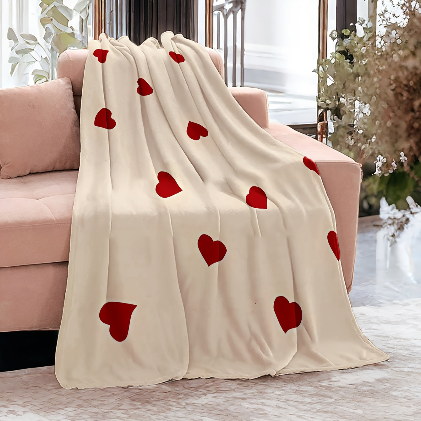 Soft sofa throw blanket featuring a red heart pattern for Valentine's Day. This cozy blanket is knit from warm polyester coral fleece and showcases a contemporary style. The digital print craftsmanship makes it perfect for use on the couch, bed, camping