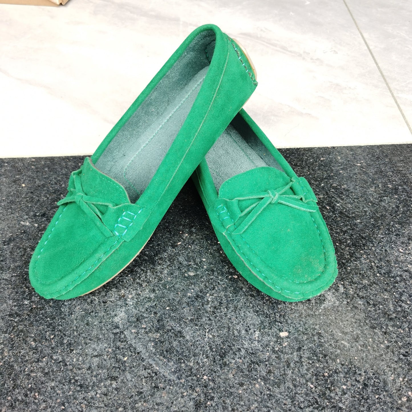 Retro flat loafers with bow detail, slip on style, and soft sole for casual wear.