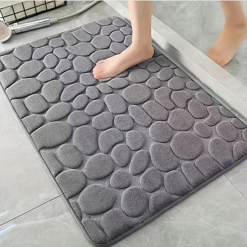 Soft, non-slip bath rug with excellent absorbency; machine washable with oblong shape and low pile.