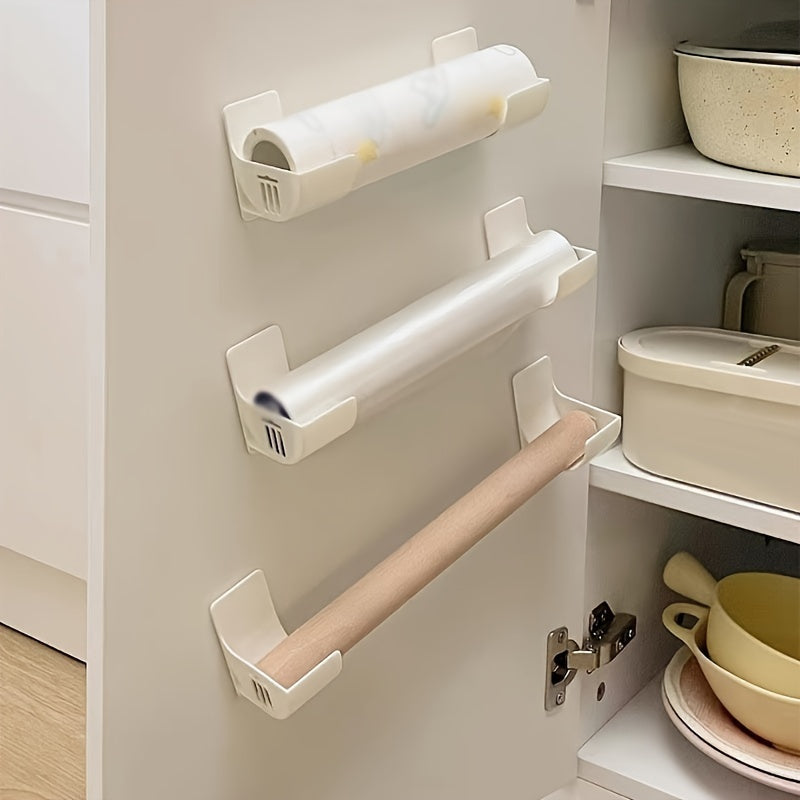 Set of four white adjustable kitchen storage racks without the need for drilling, can be used for various purposes including organizing cling film, garbage bags, and more. These plastic organizers are space-saving and can be easily mounted on the side of