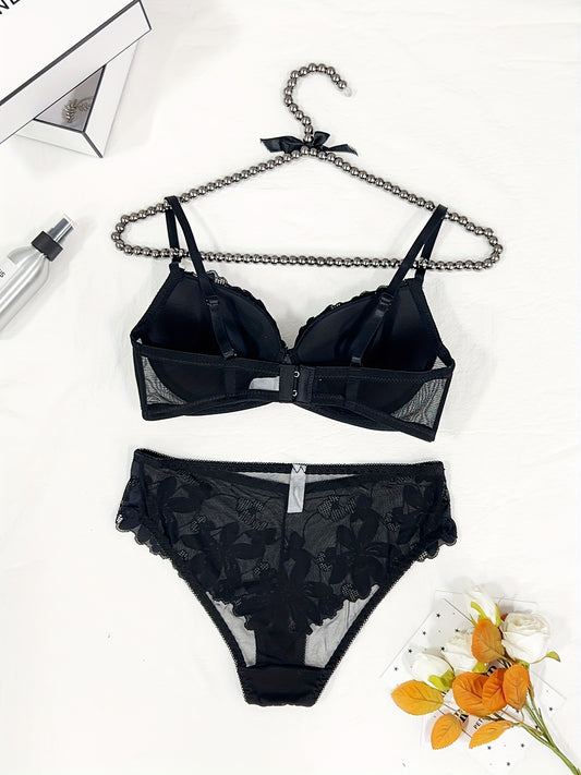 Floral embroidered lingerie set for women featuring a comfortable push-up bra, low-rise thong, mesh detail, and sexy triangle pant. Made with a nylon blend for breathability.