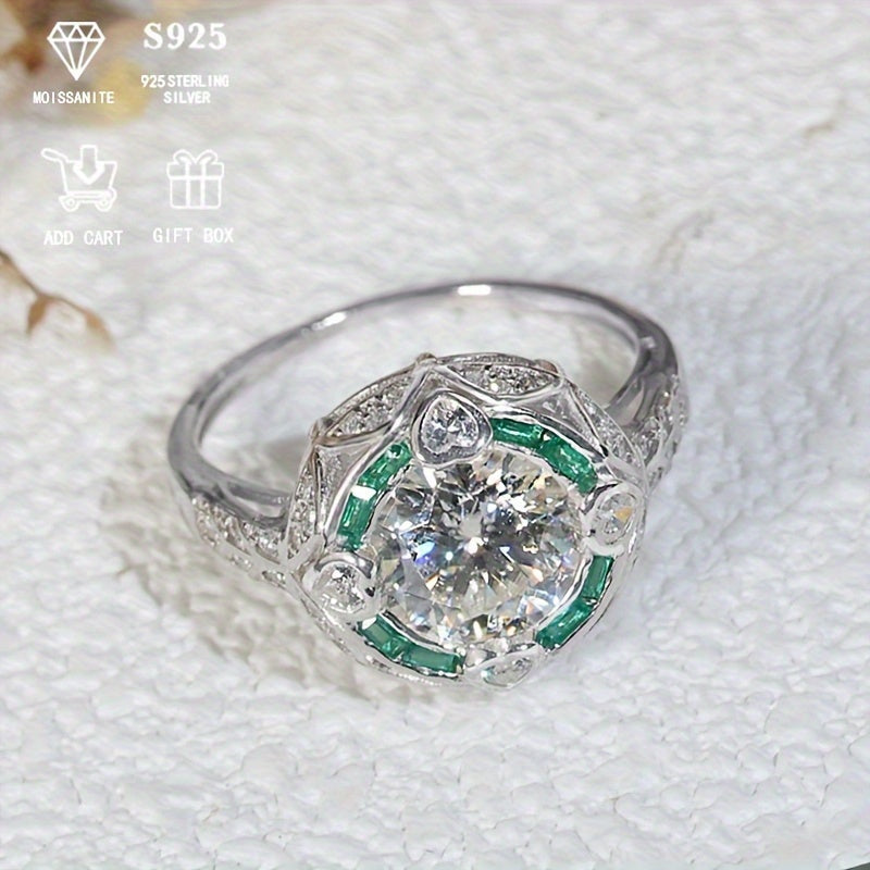 Luxurious Royal Style 2 Carat Moissanite Engagement Ring for Ladies, made with 925 Sterling Silver, adorned with Heart Accents, featuring a Round Gemstone. This Hypoallergenic S925 Wedding Band makes a perfect Anniversary Gift that comes with a Gift Box.