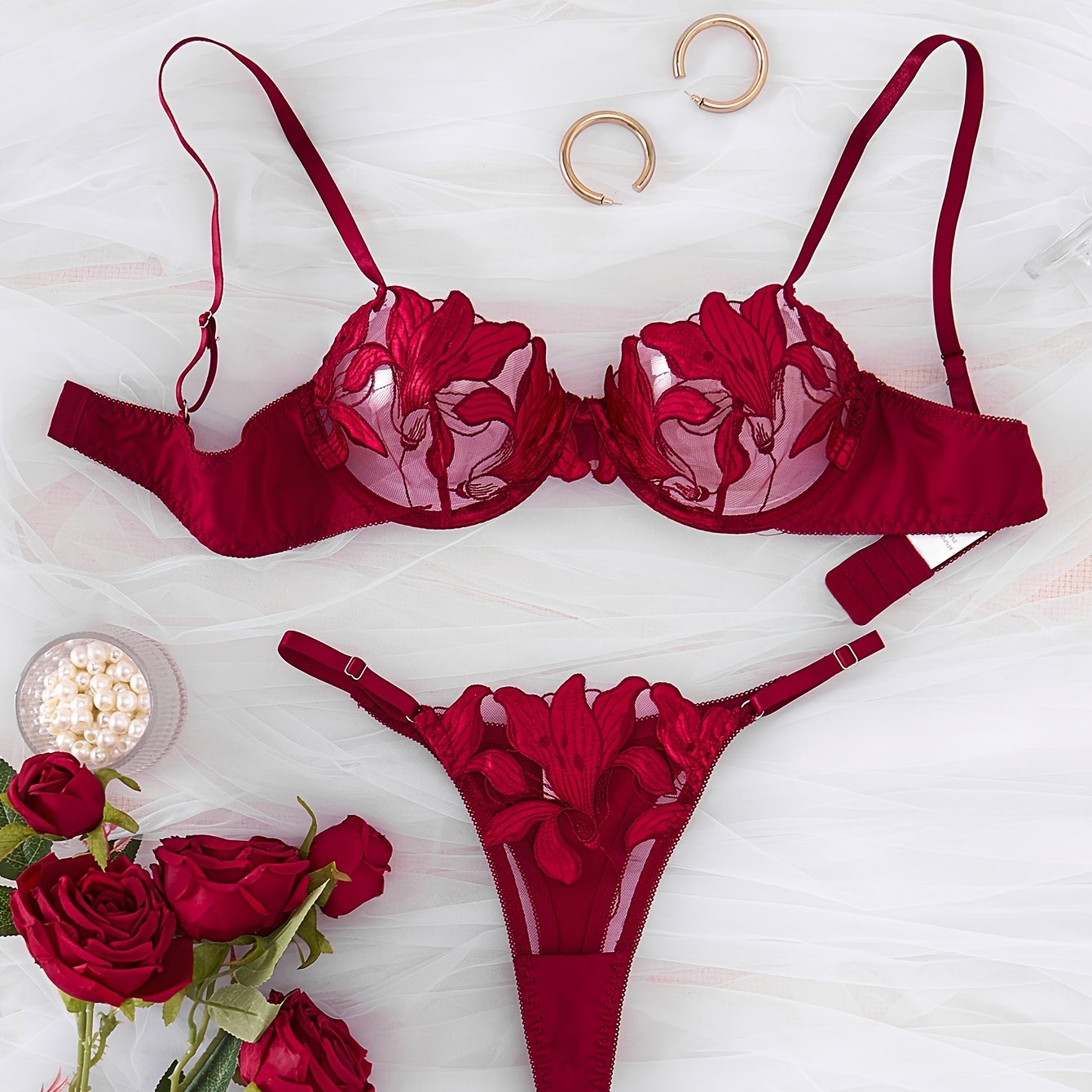 Floral embroidered cami bra and panties set for women.