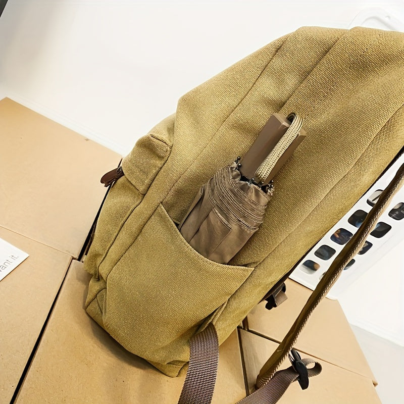 Sturdy canvas backpack with adjustable straps, perfect for school, travel, and work, fits 15-inch laptop.