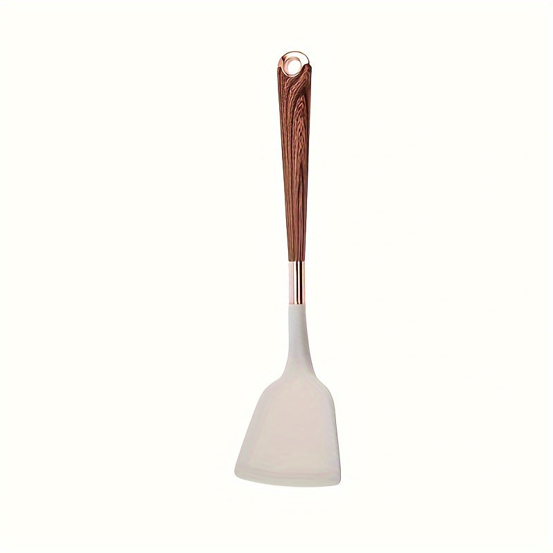 Essential for home chefs, this premium silicone spatula features a stylish wood grain handle. Heat-resistant, non-stick safe, and perfect for cooking and baking.