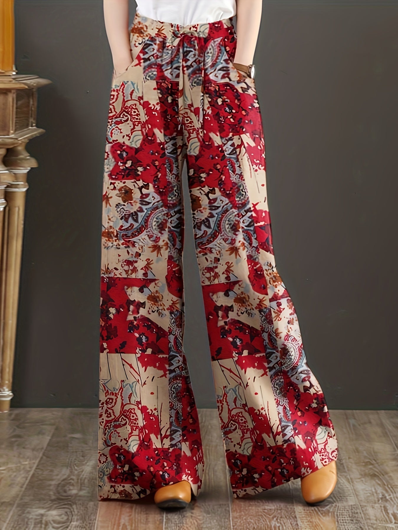 Floral cotton wide-leg pants with elastic waist, lace-up detail, and loose fit. Perfect for casual weekends and year-round comfort. Made with woven fabric for adults.