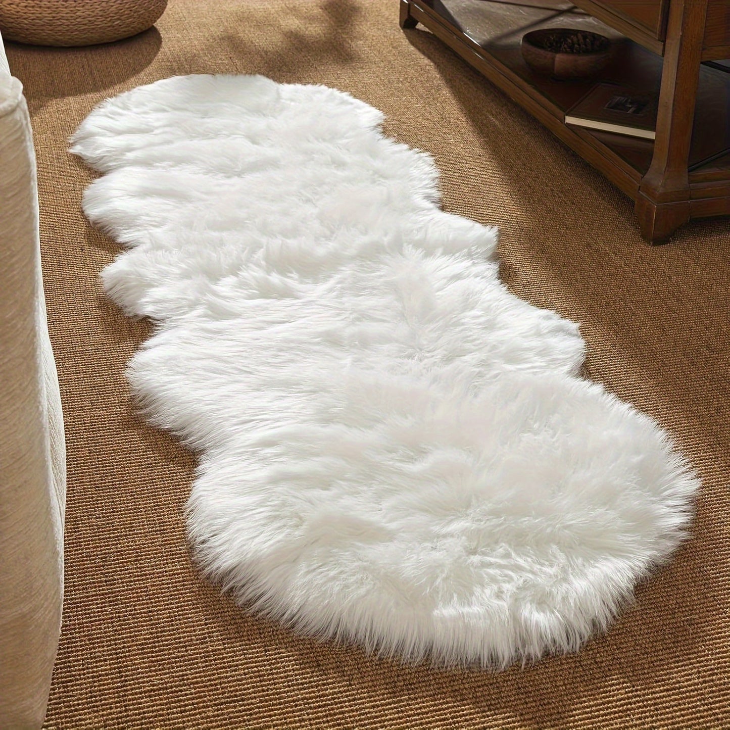 Soft and plush white faux sheepskin rug runner, perfect for nursery or living room decor. Machine washable with a flat weave, ideal for children's rooms. Measures a maximum size of 2.16m² and maximum length of 1.8m.