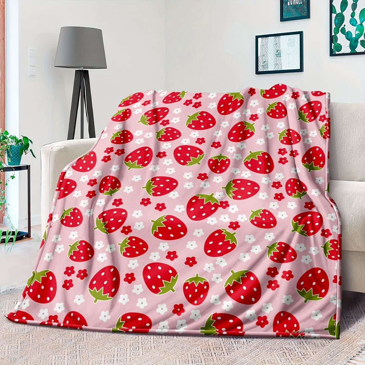 Soft and cozy pink strawberry print flannel throw blanket, perfect for all seasons. Made from 250-300g superfine fiber with digital print design. Ideal for bed or sofa, with no embellishments for a simple and elegant home decor touch.