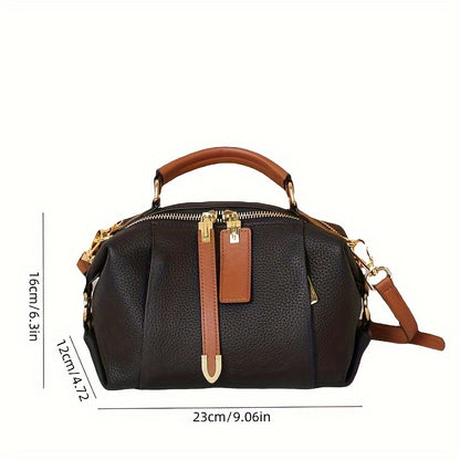 Genuine leather fashion handbag for women with versatile carrying options, large capacity, and stylish design.