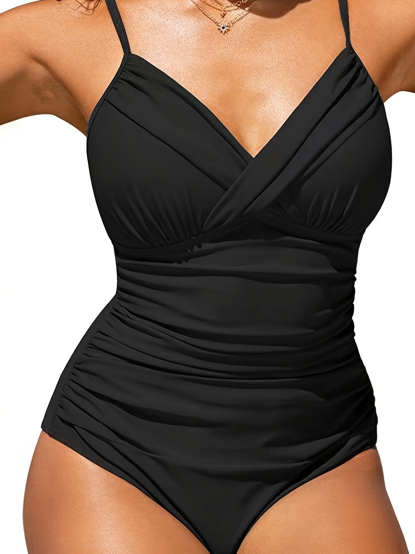 Women's solid color one-piece swimsuit with ruched cross front design for a slim, conservative fit.