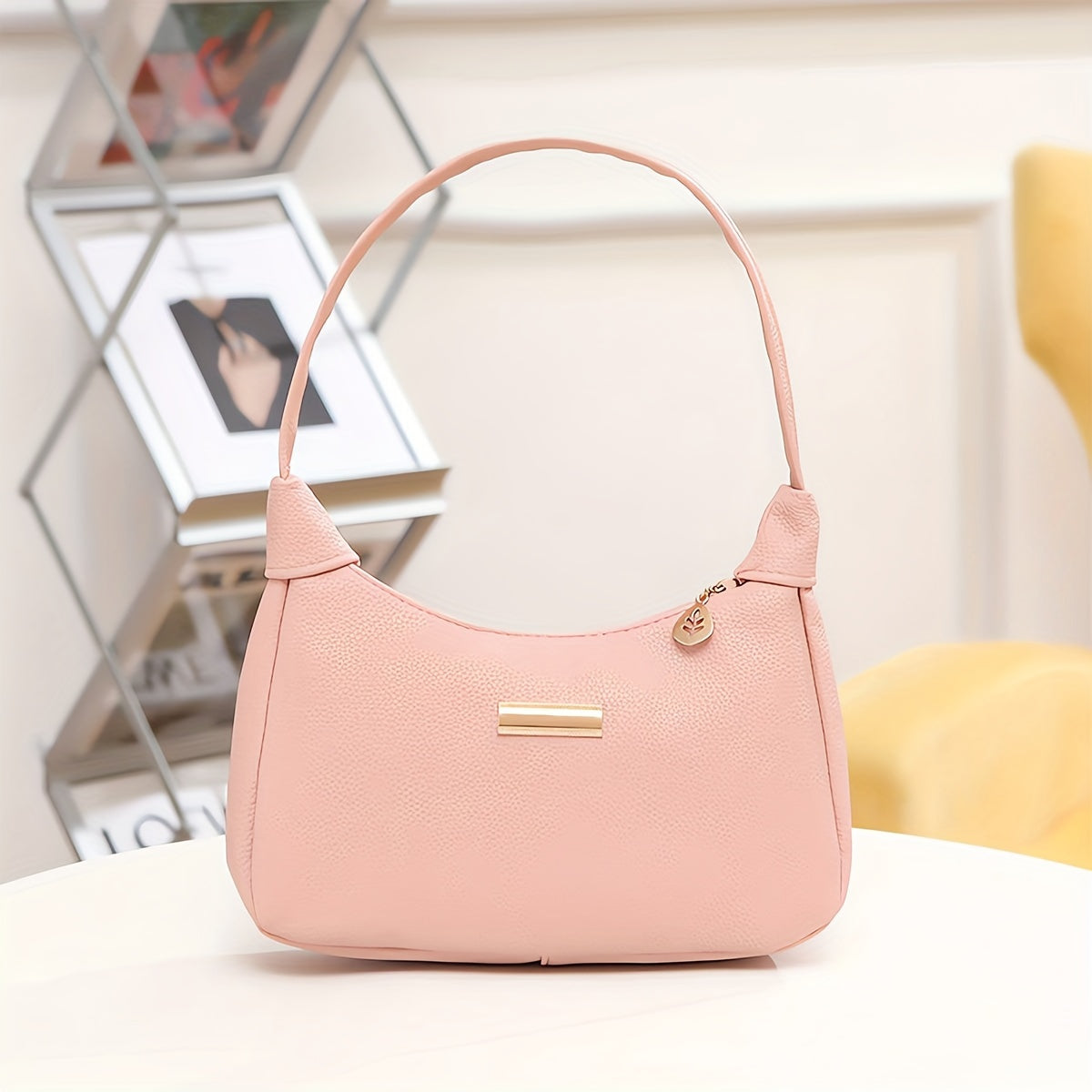 Minimalist crossbody bag for women with solid color and hardware detail, fixed straps, zipper closure, lightweight and lined with polyester. Available in black, white, pink, khaki, and