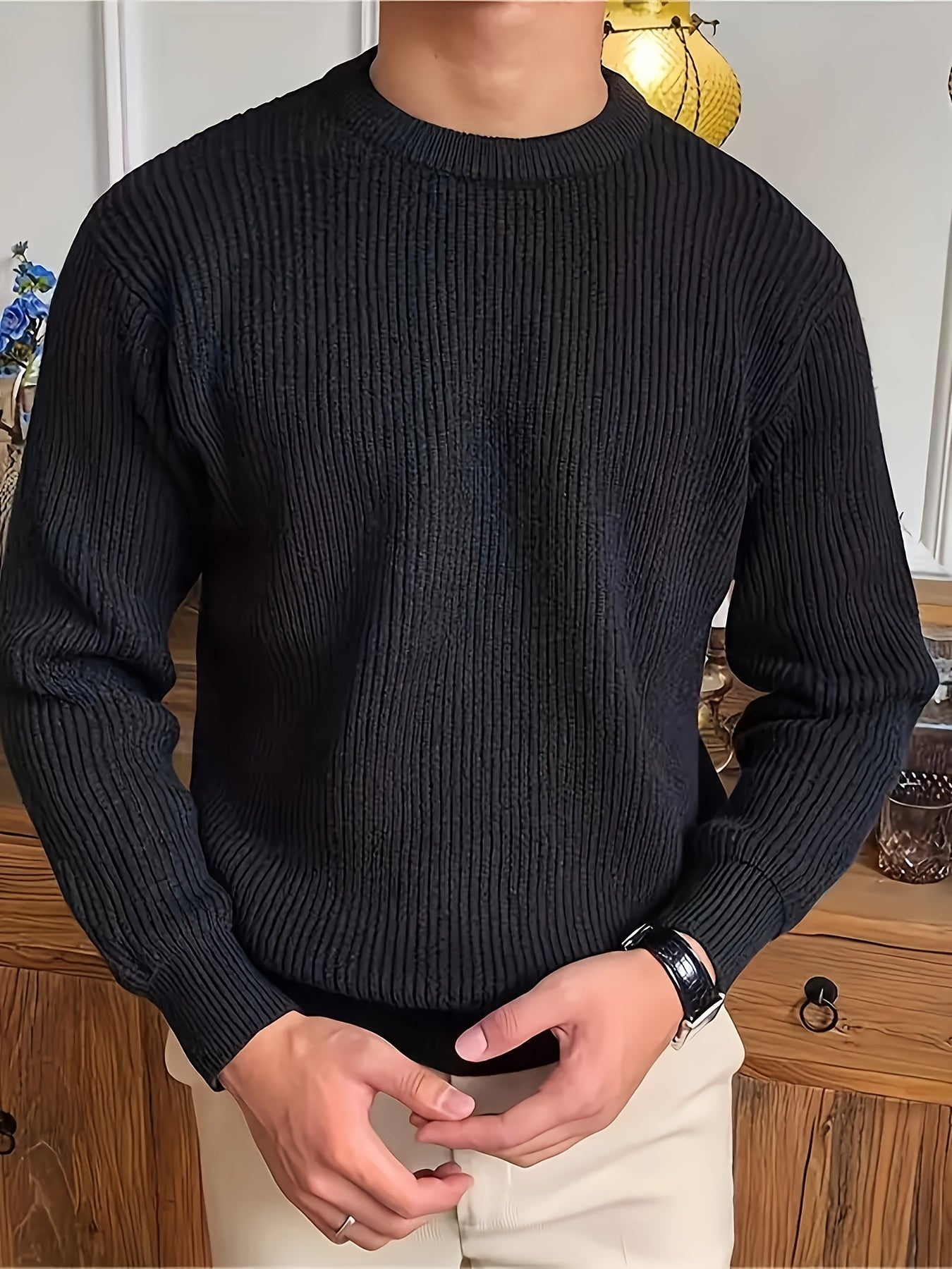 Men's black cotton-blend crew neck sweater with soft ribbed texture, perfect for fall/winter warmth in a casual attire.