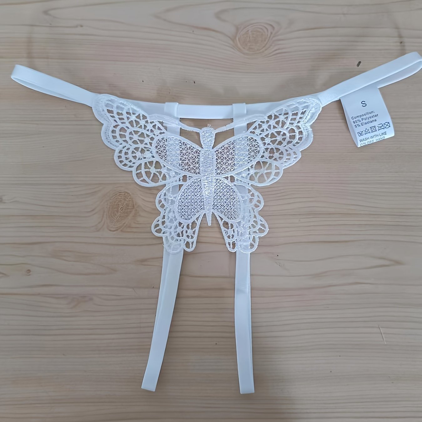 Sexy butterfly pattern panties with open crotch and low waist for women.