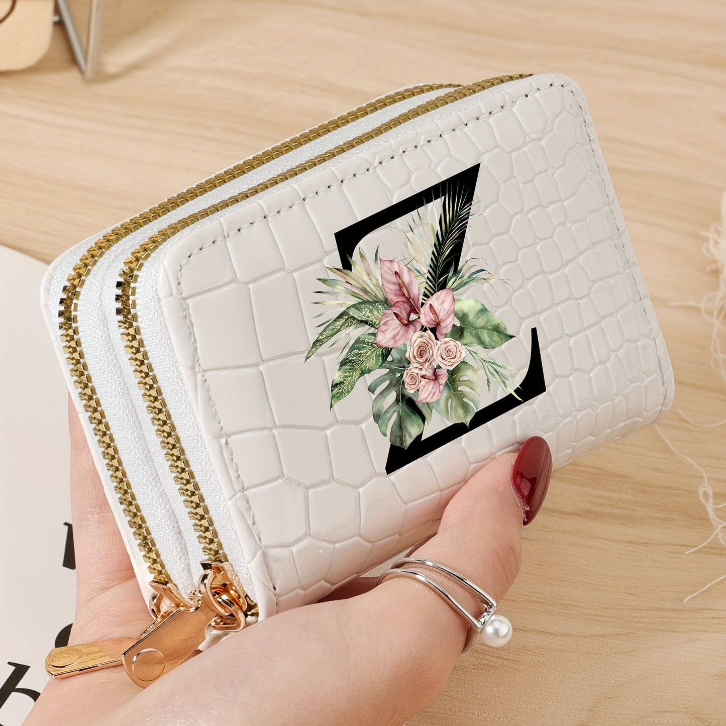 Women's credit card wallet with elegant floral letter print in black & white. Features large capacity, dual zipper, crocodile texture PU, lightweight design with nylon lining for everyday