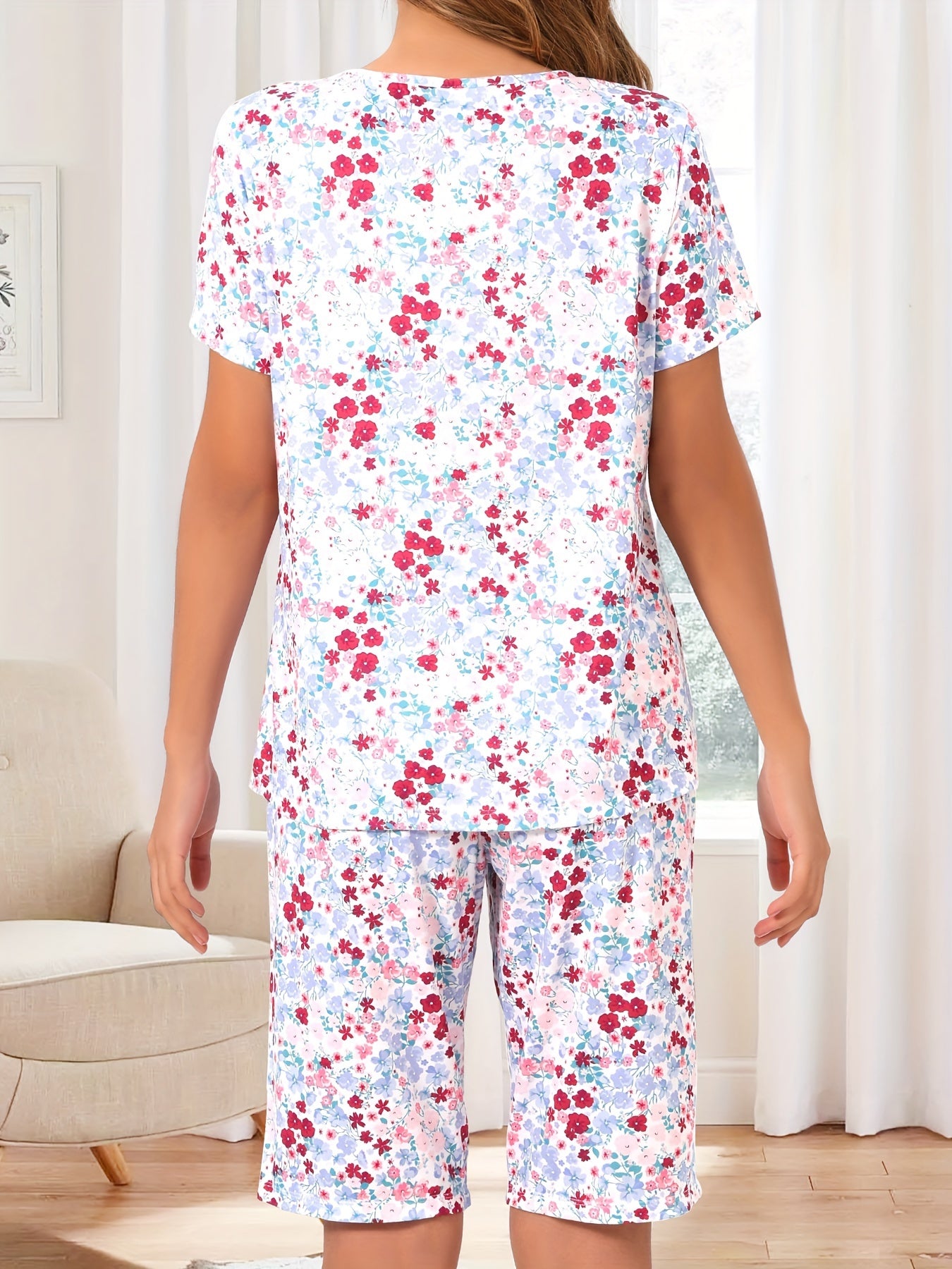 Floral print 2-piece pajama set for women with round neck top and shorts, perfect for summer sleepwear.