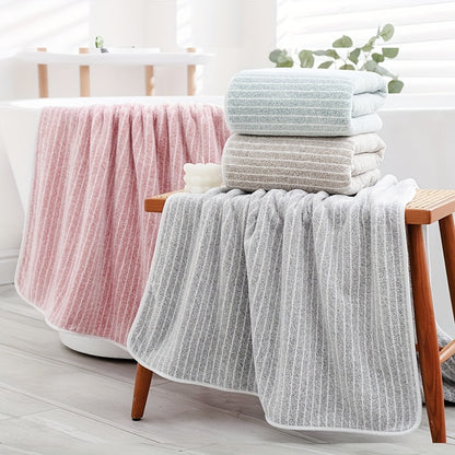 A 140cm*70cm plush bath towel perfect for home, hotel, kitchen, and more. Ultra-absorbent, soft, and gentle on skin.