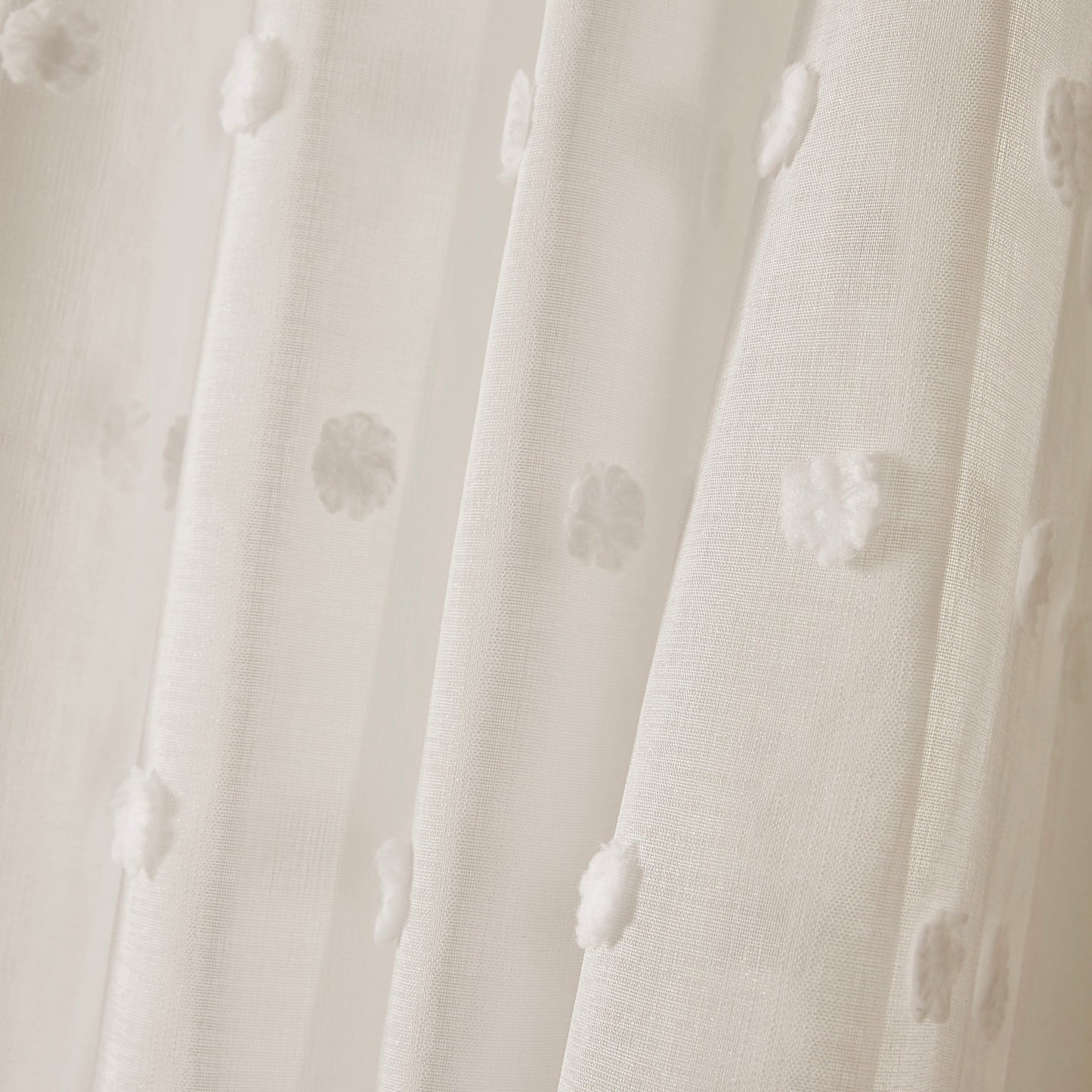 Sheer panel with rod pocket top featuring boho-style polka dot embroidery - crafted from imitation hemp fabric. This machine-washable drapery offers room darkening benefits for a variety of living spaces. With easy hanging and a fresh minimalist design