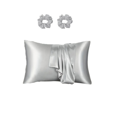 Luxurious satin pillowcase and hair scrunchies with minimalist design. Ideal for home, hotel, or bedroom use. Includes matching set of 2 scrunchies.