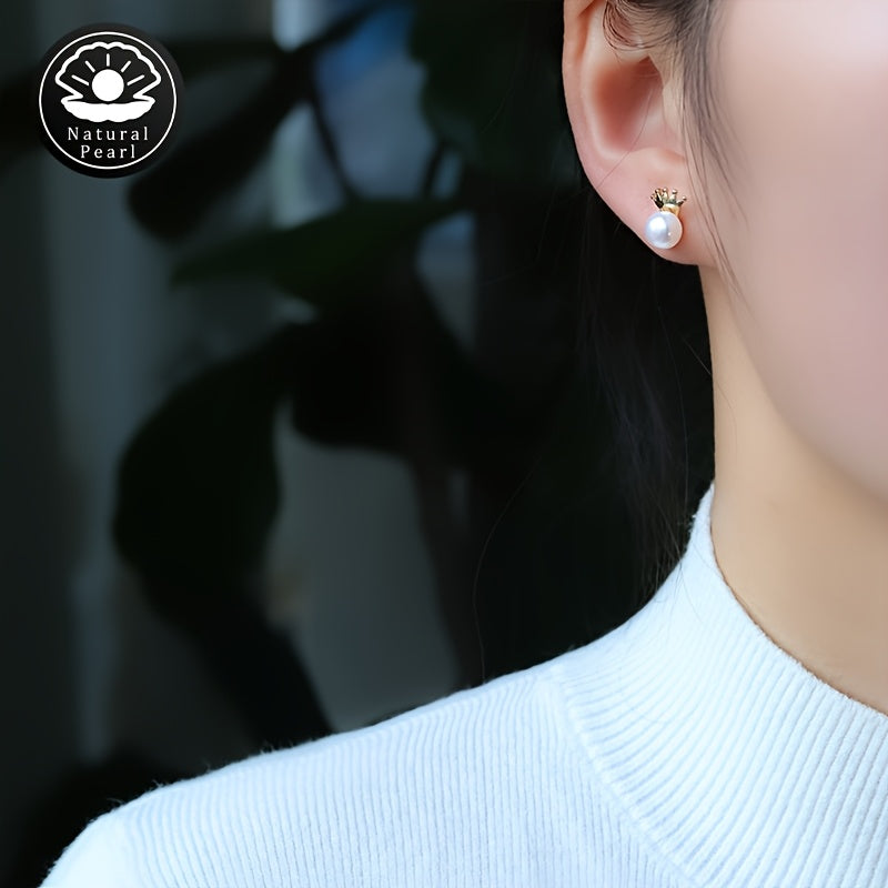 These MUFAN Elegant Luxury Stud Earrings feature a pair of 7-8mm Flat Round Natural Freshwater Pearls adorned with a Small Crown design. They are the perfect June Birthstone accessory for daily wear or gifting, making them a versatile choice for all