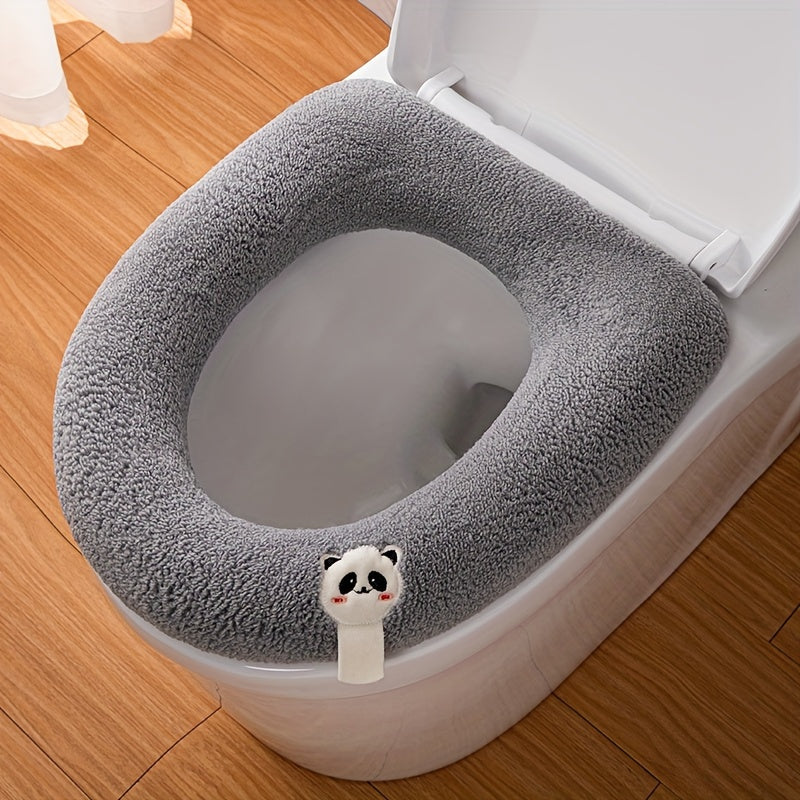 Thickened toilet seat cover with handle in cute cartoon solid colors, soft and comfortable.