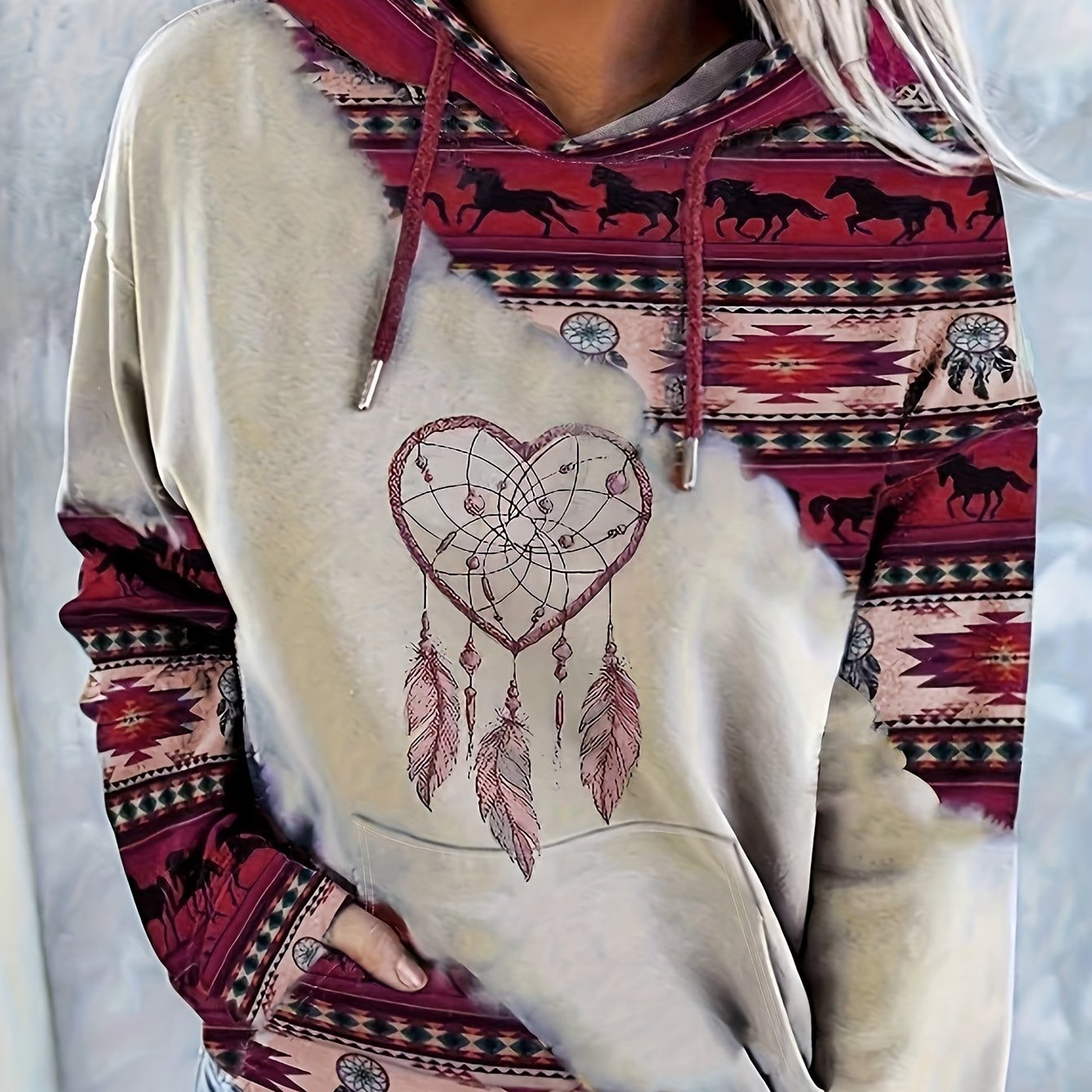 Casual hooded sweatshirt for women with ethnic print, knit fabric, and drawstring.