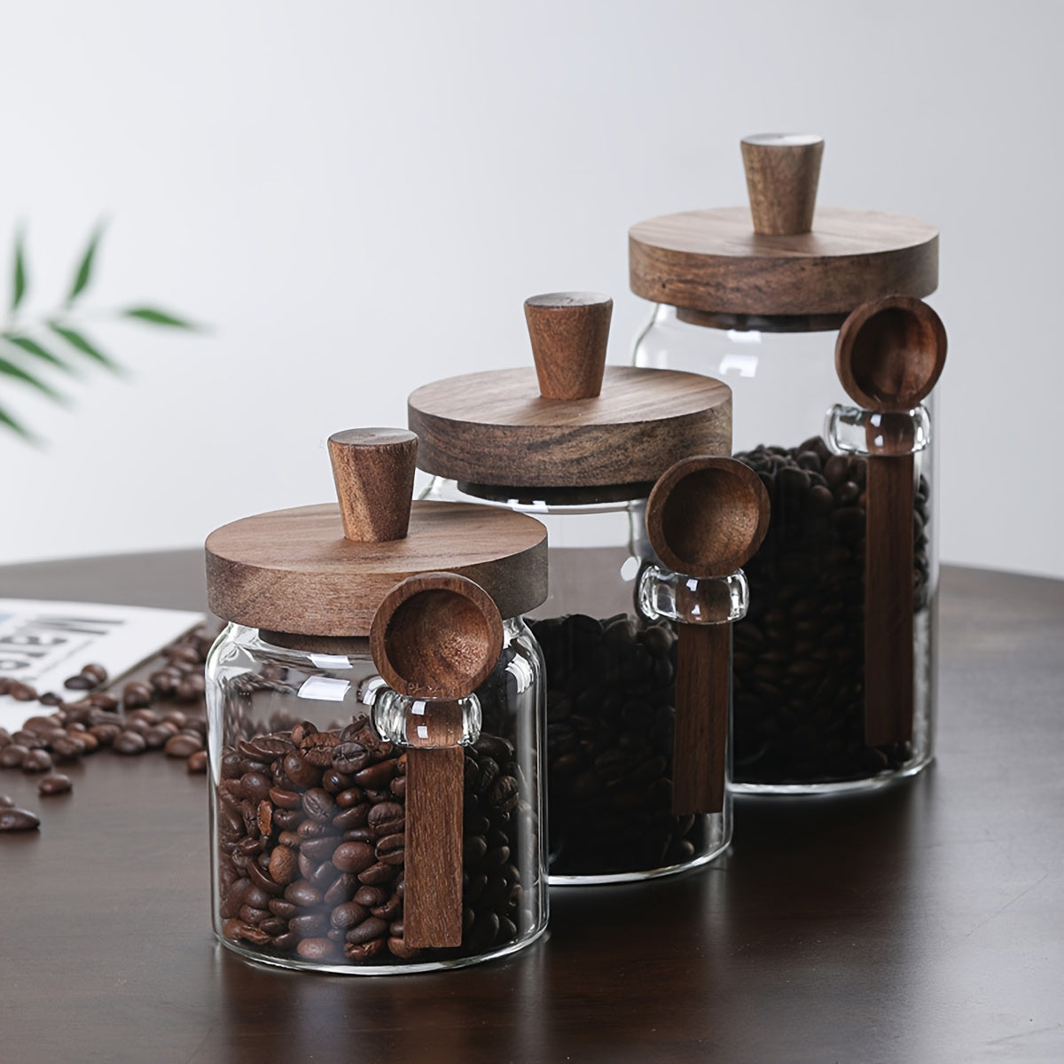 Glass containers for storing coffee, tea, grains, snacks, and pickles.