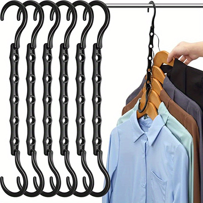 Organize your closet with the 6 Pack Magic Hangers - a space-saving solution for heavy clothes storage. These sturdy plastic hangers will maximize your closet space and keep your wardrobe neat and tidy.