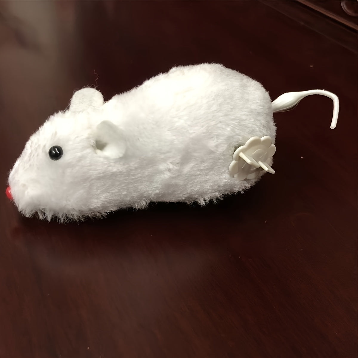 Non-electric, interactive cat toy with wind-up running rat made of durable vinyl material, suitable for kittens, promoting play and exercise without the need for batteries.