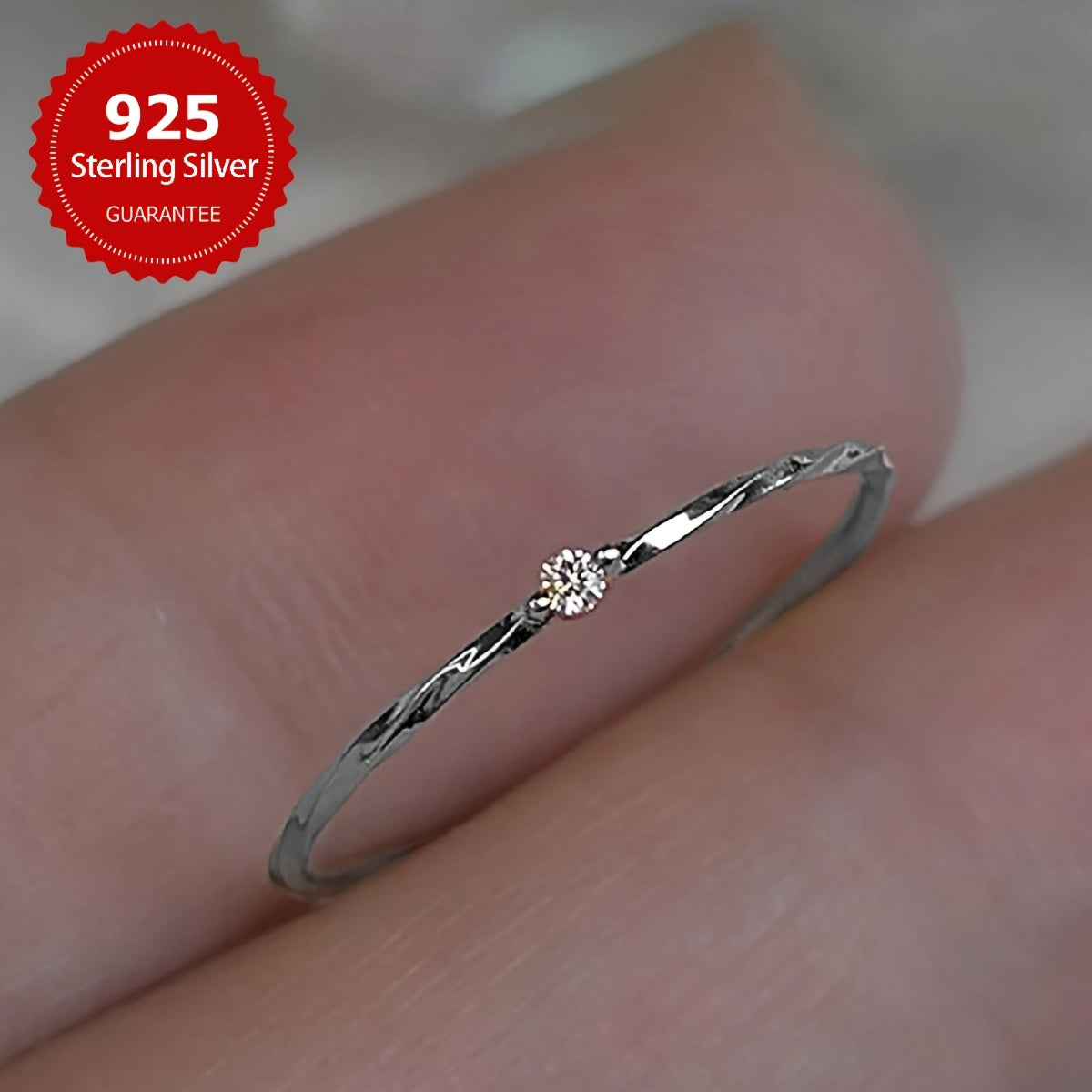 Chic and minimalistic 925 sterling silver ring accented with small 5A synthetic cubic zirconia. This lightweight and versatile jewelry piece is perfect for women to wear daily, to parties, and during Ramadan - suitable for all seasons.