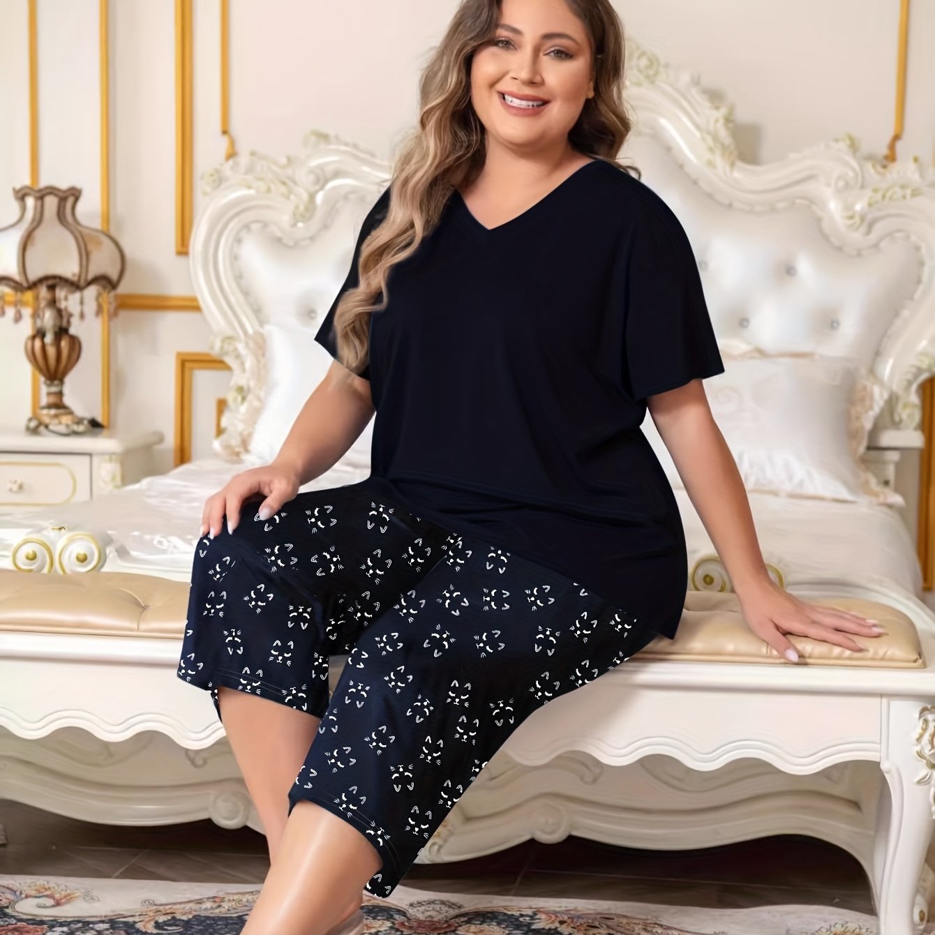 Plus size women's lounge set featuring a solid V-neck top and floral capri pants.