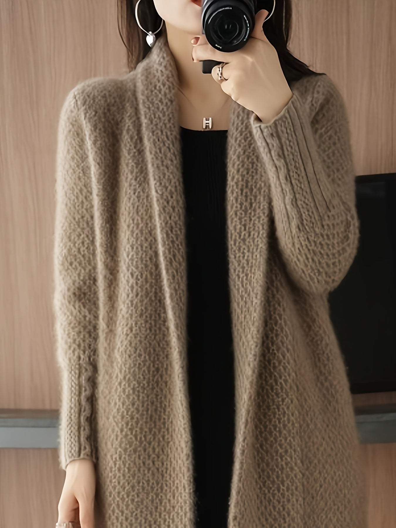 Women's elegant long cardigan sweater made from knitted fabric for autumn/winter. Features solid color, long sleeves, over-the-knee length, acrylic material, and reversible collar design.