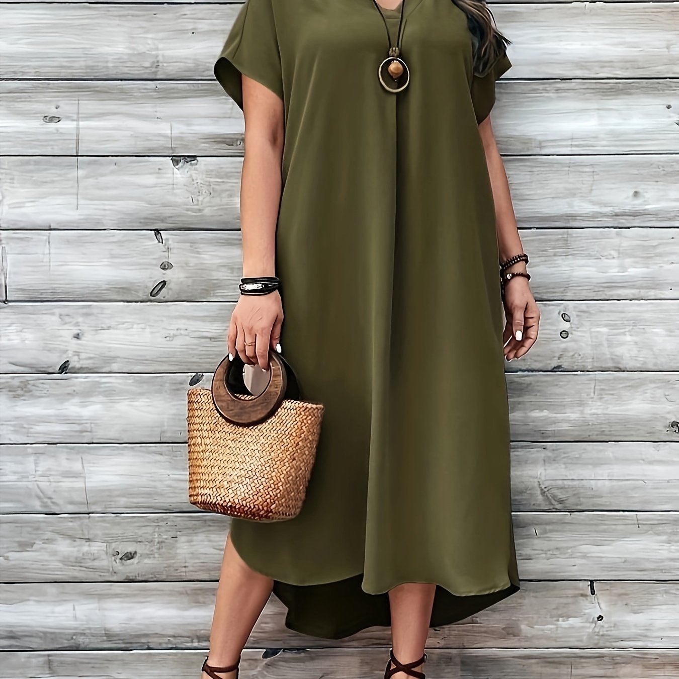 Women's plus size solid curved hem dress with casual V-neck and short sleeves.