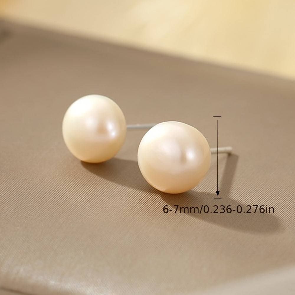 Set of 3 pairs of Saudade freshwater pearl earrings featuring natural round pearls in white, pink, and purple. The earrings are made of 925 sterling silver ear needles designed in a simple style for both daily wear and gift-giving occasions. These