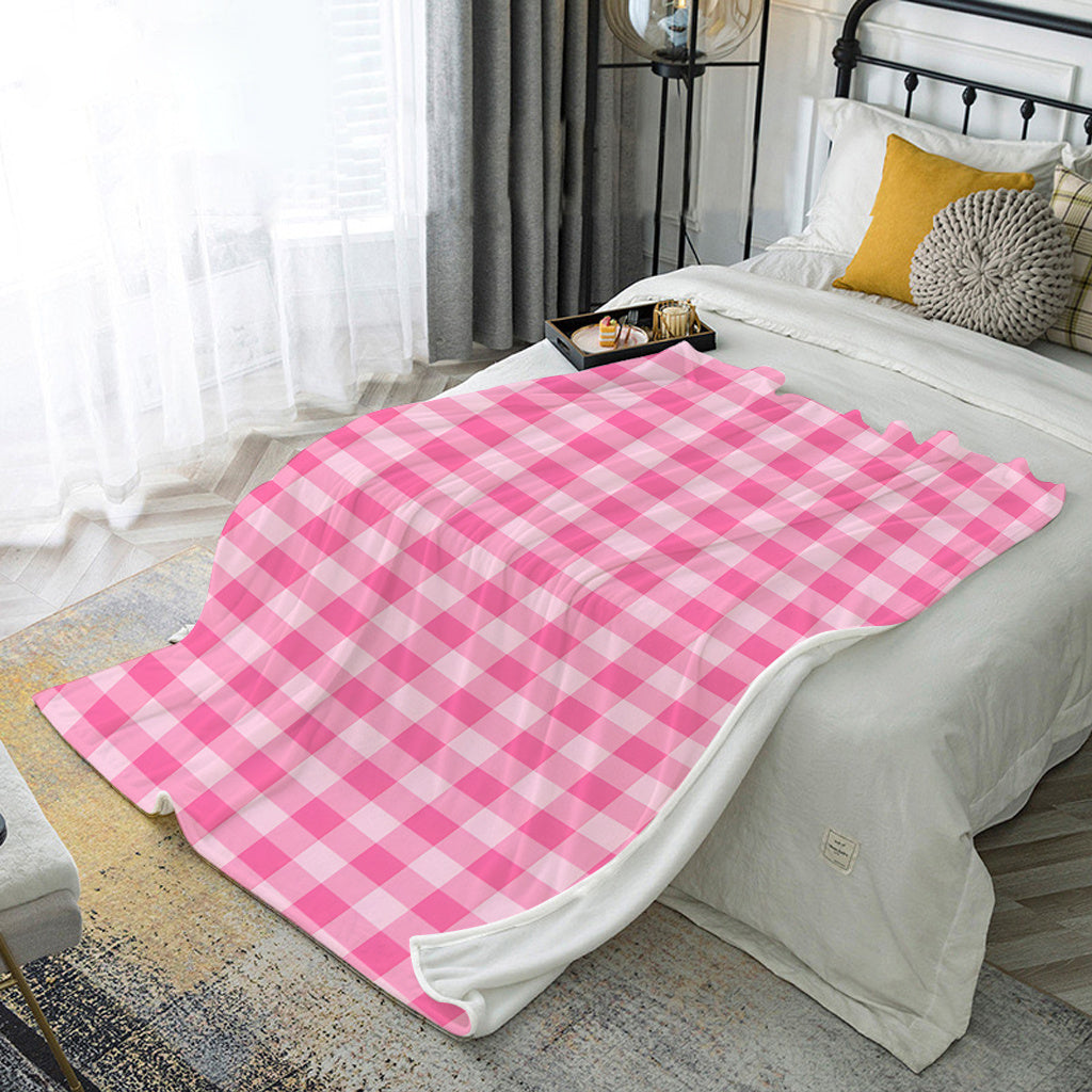 Soft and cozy polyester knit pink gingham flannel throw blanket. Ideal for adding a touch of contemporary style to your bedroom, sofa, or living room decor. Perfect for all-season use and makes an ideal gift for girls, daughters, and sisters. Features a