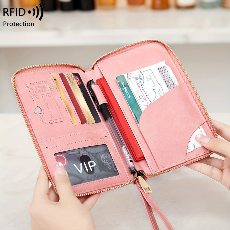 Brown PU travel wallet with RFID blocking for passports, cards, tickets, and IDs. Zipper closure and wrist strap, compact design with multiple compartments for secure organization.