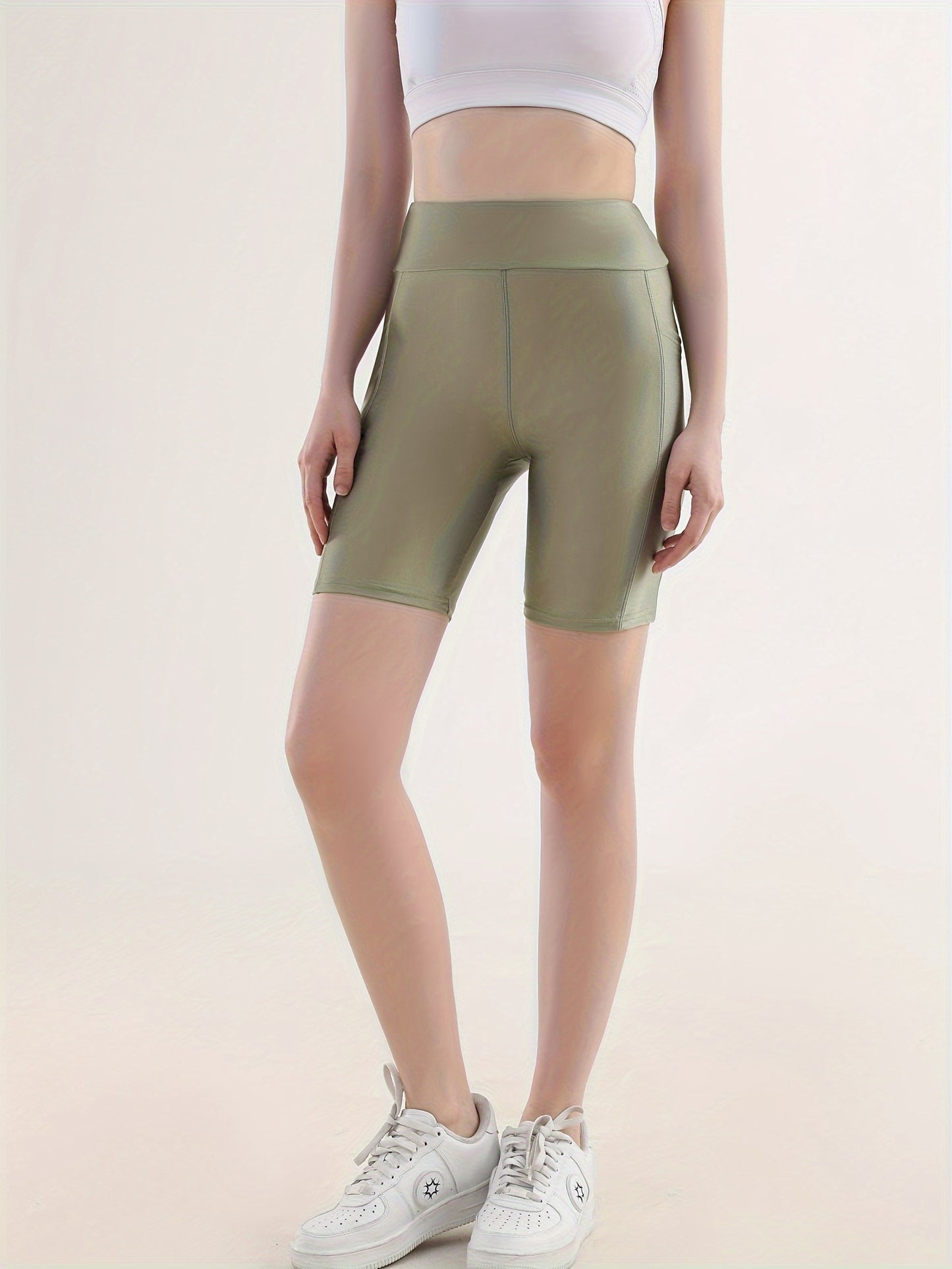 Sporty high-waist cropped leggings with side pockets, perfect for running.