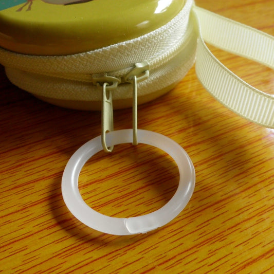 12 durable plastic rings for shower curtains, keychains, bags, and DIY projects.