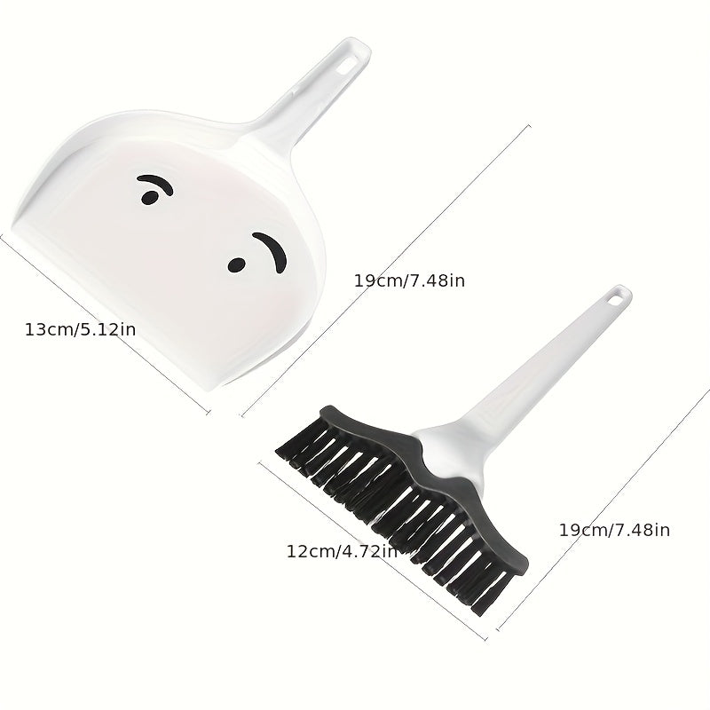 Portable handheld cleaning brush and dustpan set, perfect for any surface such as desks, pet cages, sofas, furniture, window crevices, and ideal for travel and camping. Made of durable ABS material, no electricity required. Includes a mini duster and