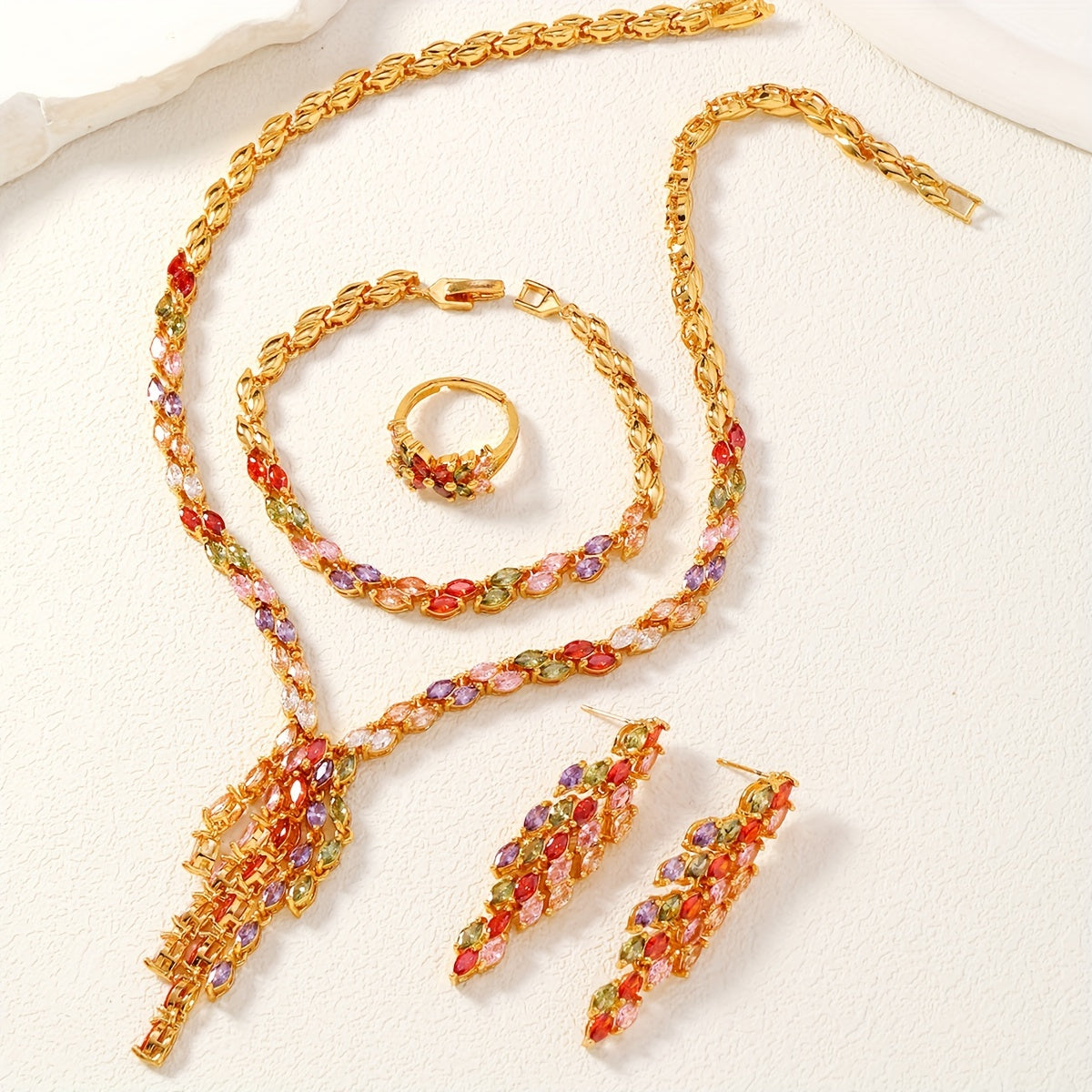 One set of Middle Eastern Saudi Arabian wedding jewelry, consisting of four pieces: a full tassel color cubic zirconia copper set for women, including 1 necklace, 1 bracelet, 1 pair of earrings, and 1 ring.