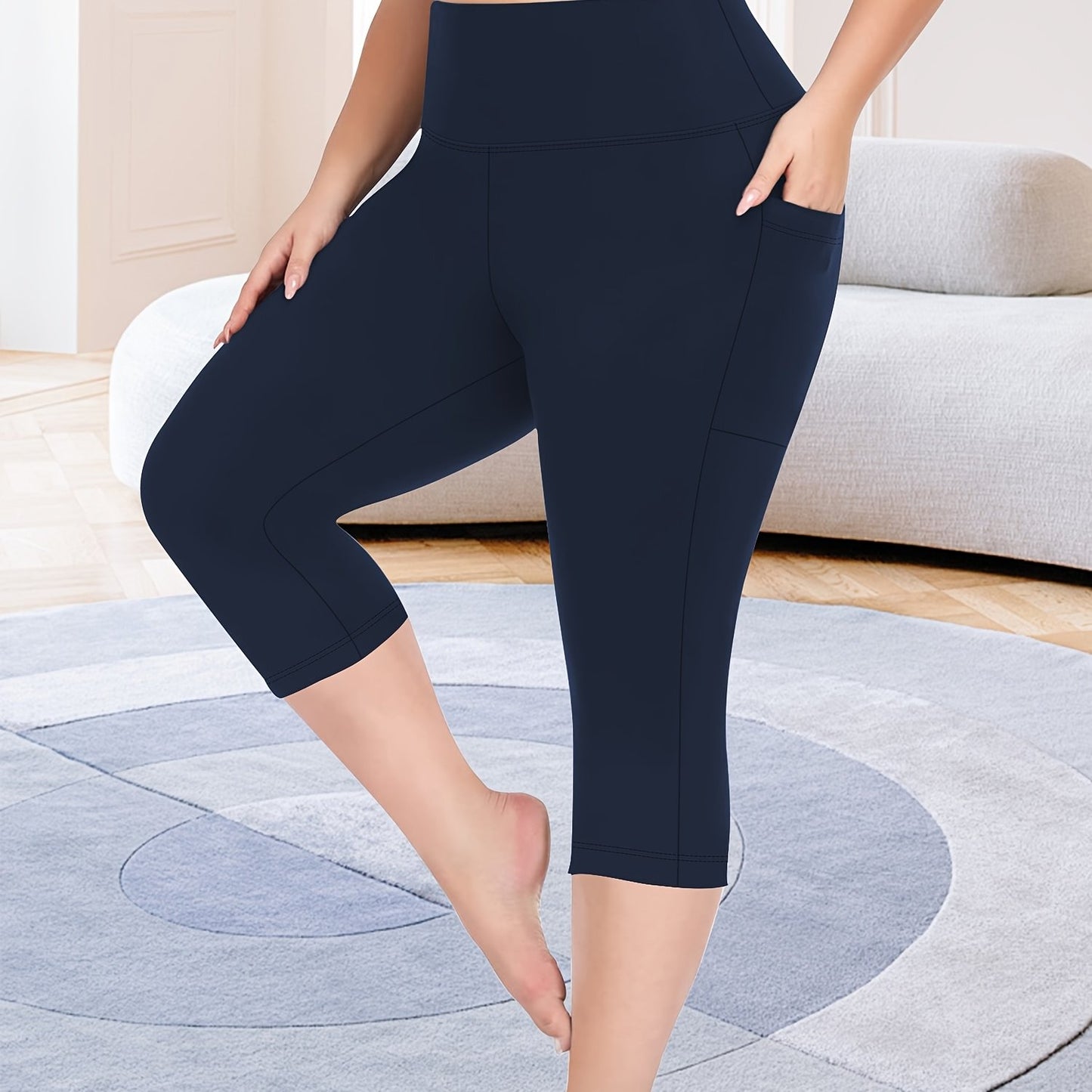 High-waisted capri leggings for plus-size women with side phone pockets, ideal for workouts.