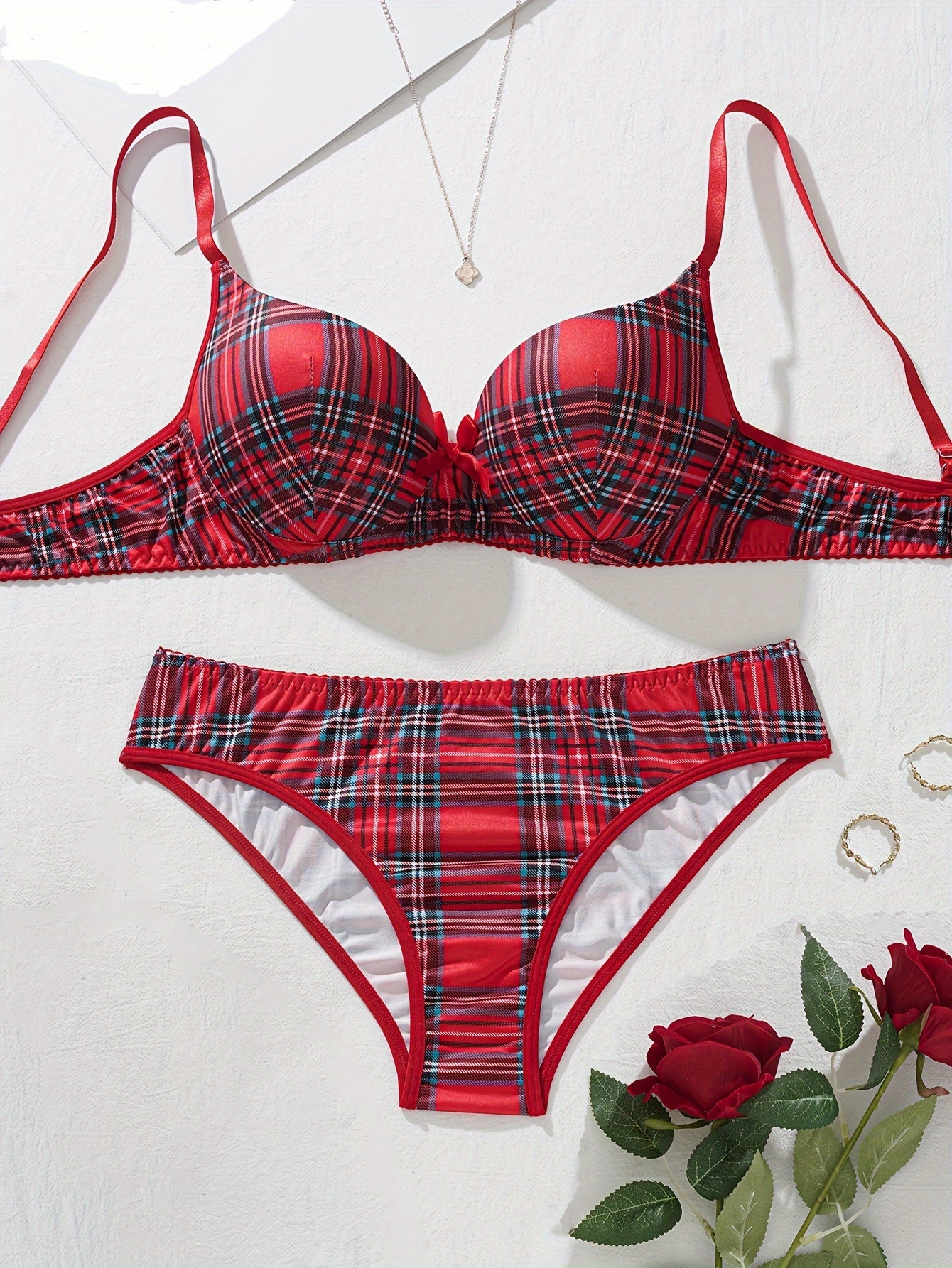 Plaid lingerie set for women made of 95% polyester and 5% elastane. Features medium support bra and mid-rise briefs in color block design. No chest pad included. Part of adult lingerie