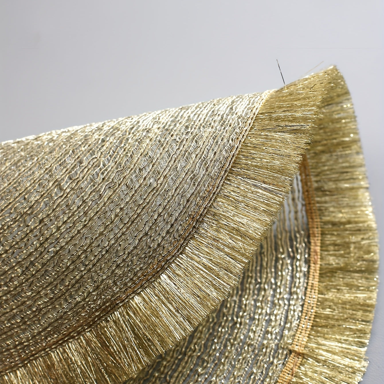 Insulated placemats with gold tassels, ideal for various occasions and easy to clean and use.