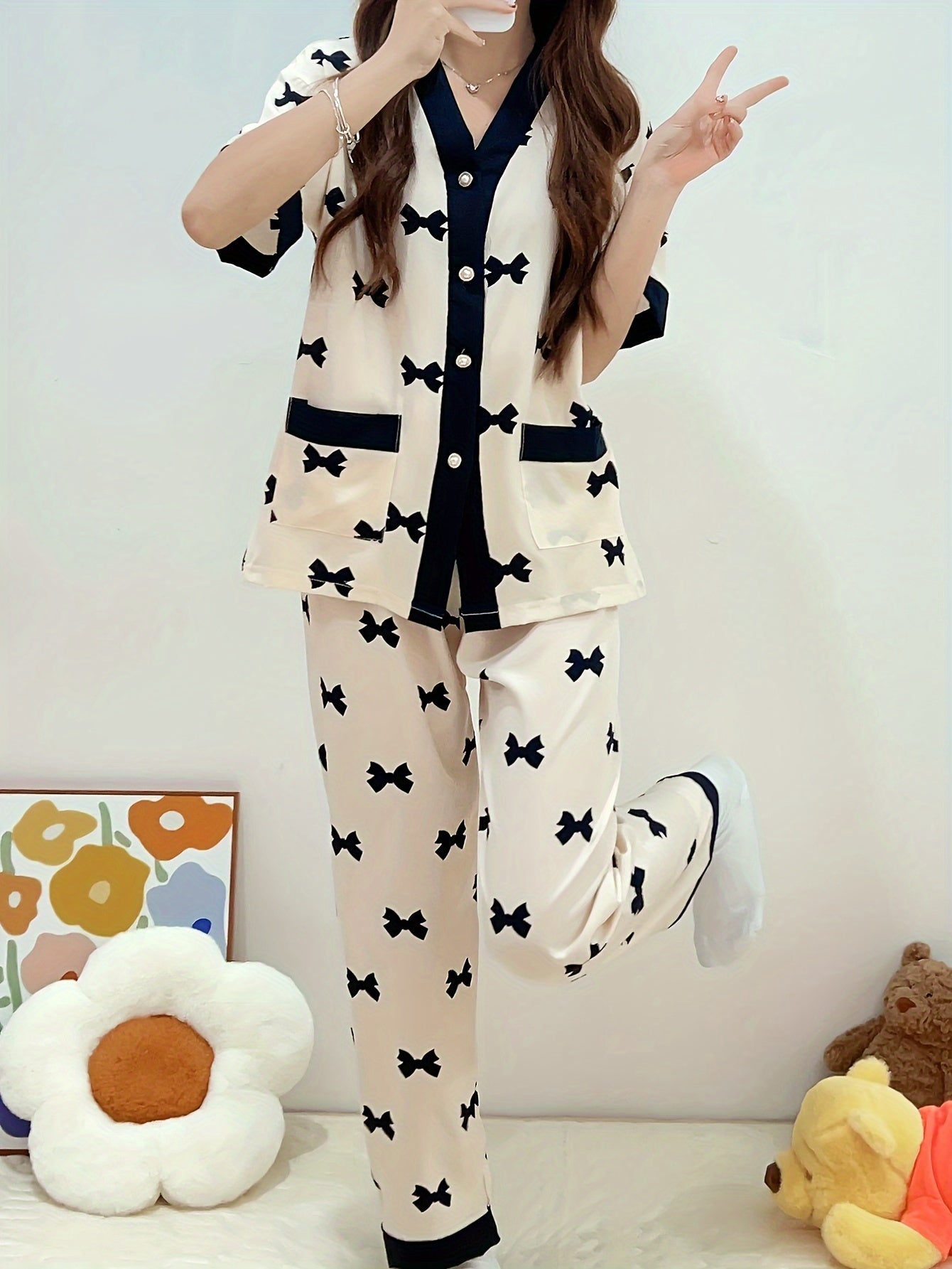 Summery short-sleeved women's pajama suit with sweet V-neck cardigan and thin material perfect for summer.