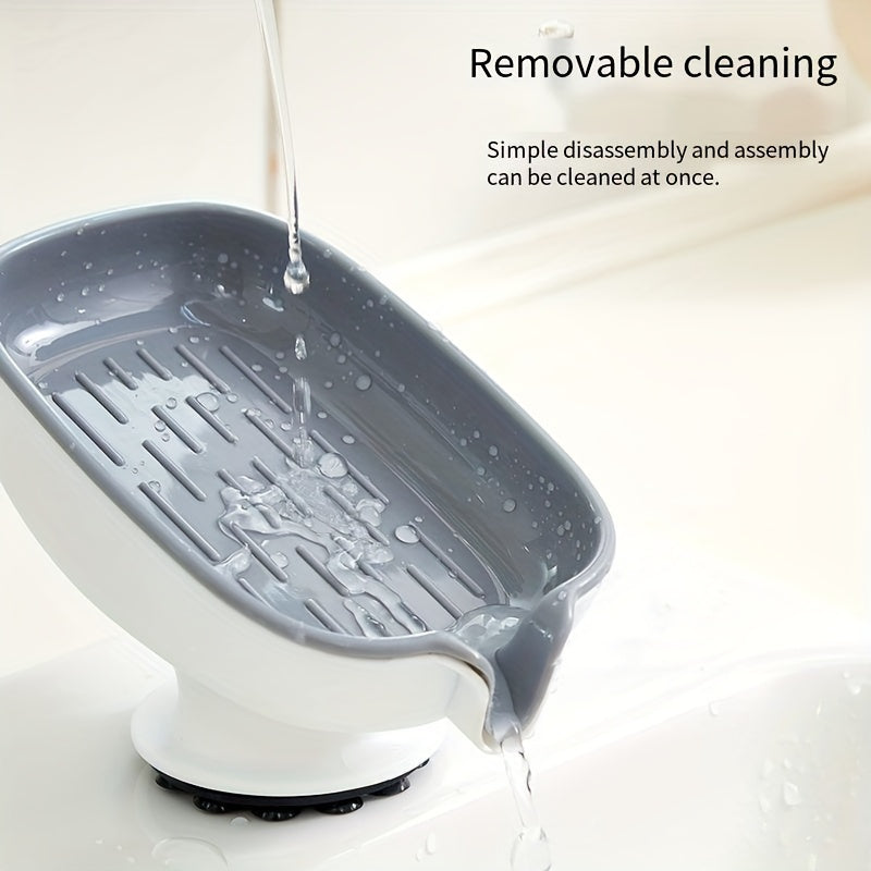 Durable plastic oval soap dish with an elegant, self-draining design for bathroom use.