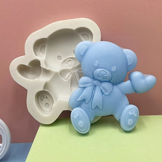 Silicone mold featuring a cute bear with a heart shape design, ideal for making mousse, fondant cakes, chocolates, and biscuits in the kitchen. This versatile tool can also be used for handmade candies, jellies, and puddings, as well as for creating drop