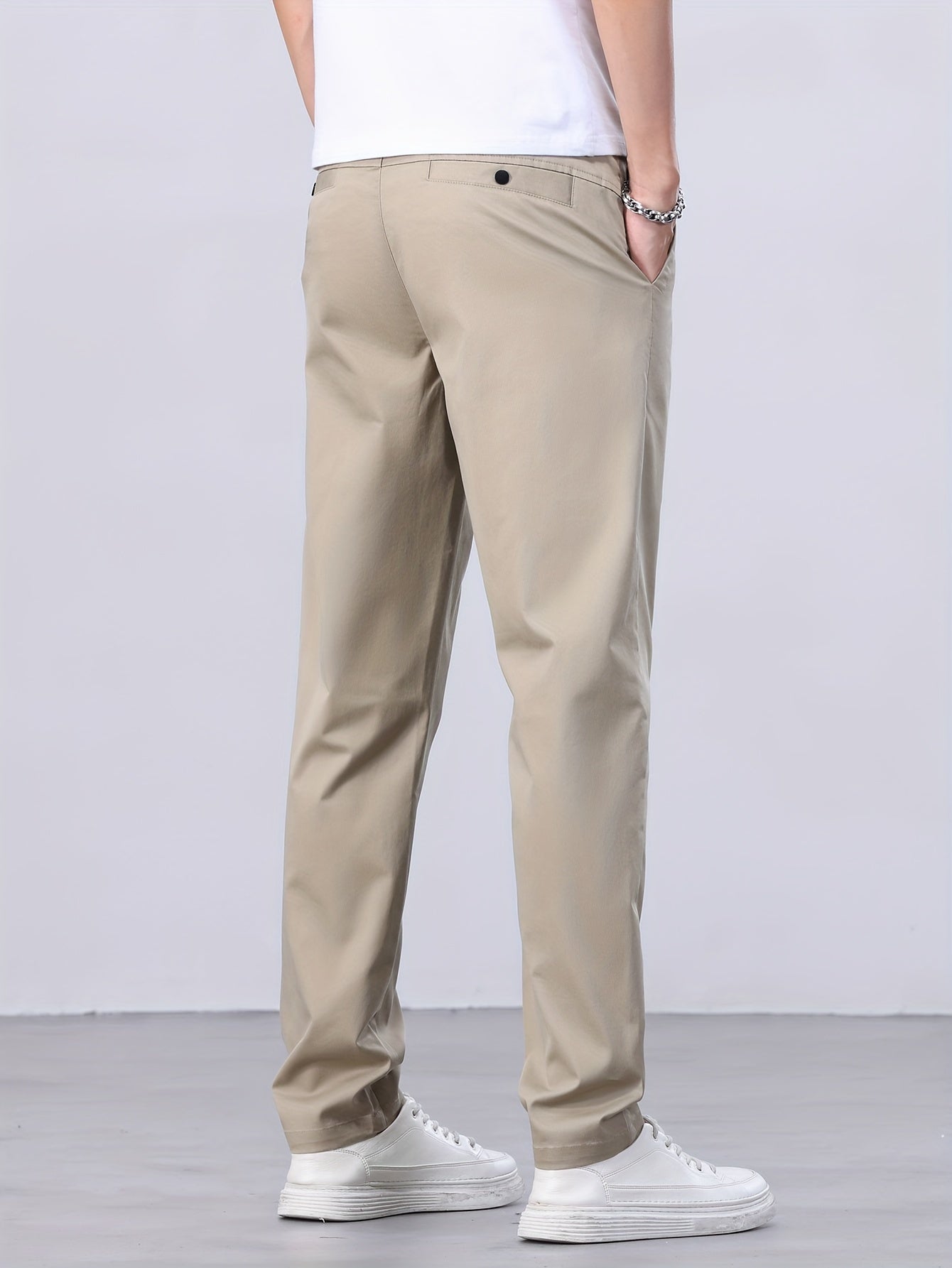 1 Men's all-season casual pants in caramel color, made of cotton blend with slight stretch and regular fit, featuring mid waist, pockets, zipper fly, and woven work style for weekend casual.