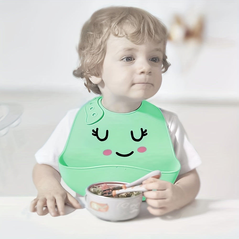 Soft and easy-to-clean food-grade silicone feeding bib with adjustable happy face design and food catcher pocket, perfect for Christmas or Thanksgiving gift giving.